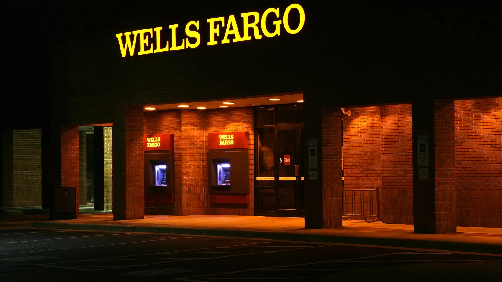 Wells Fargo walk up ATMs lit at night on Ninth Street in Durham, North Carolina .