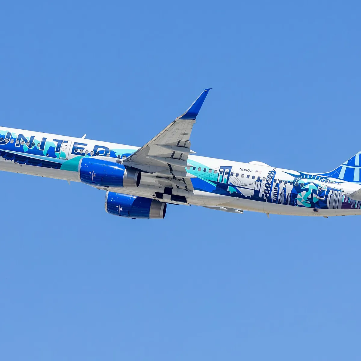 Boeing 757-224, registration N14102, of United Airlines in the "Her Art Here: New York / New Jersey" livery by Corinne Antonelli, departing Los Angeles International Airport.