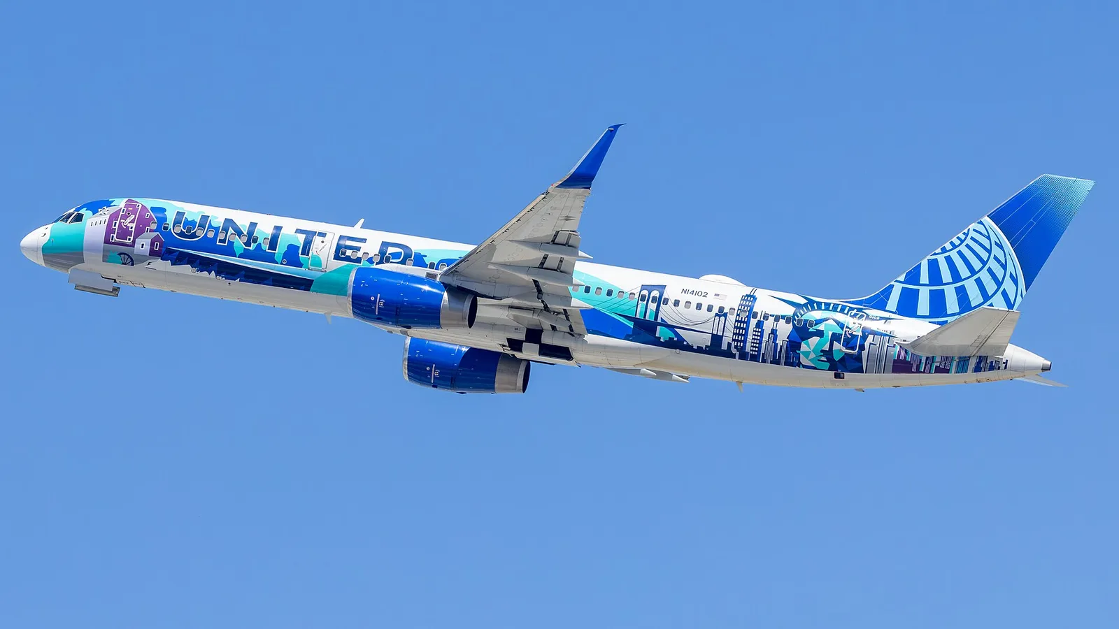 Boeing 757-224, registration N14102, of United Airlines in the "Her Art Here: New York / New Jersey" livery by Corinne Antonelli, departing Los Angeles International Airport.