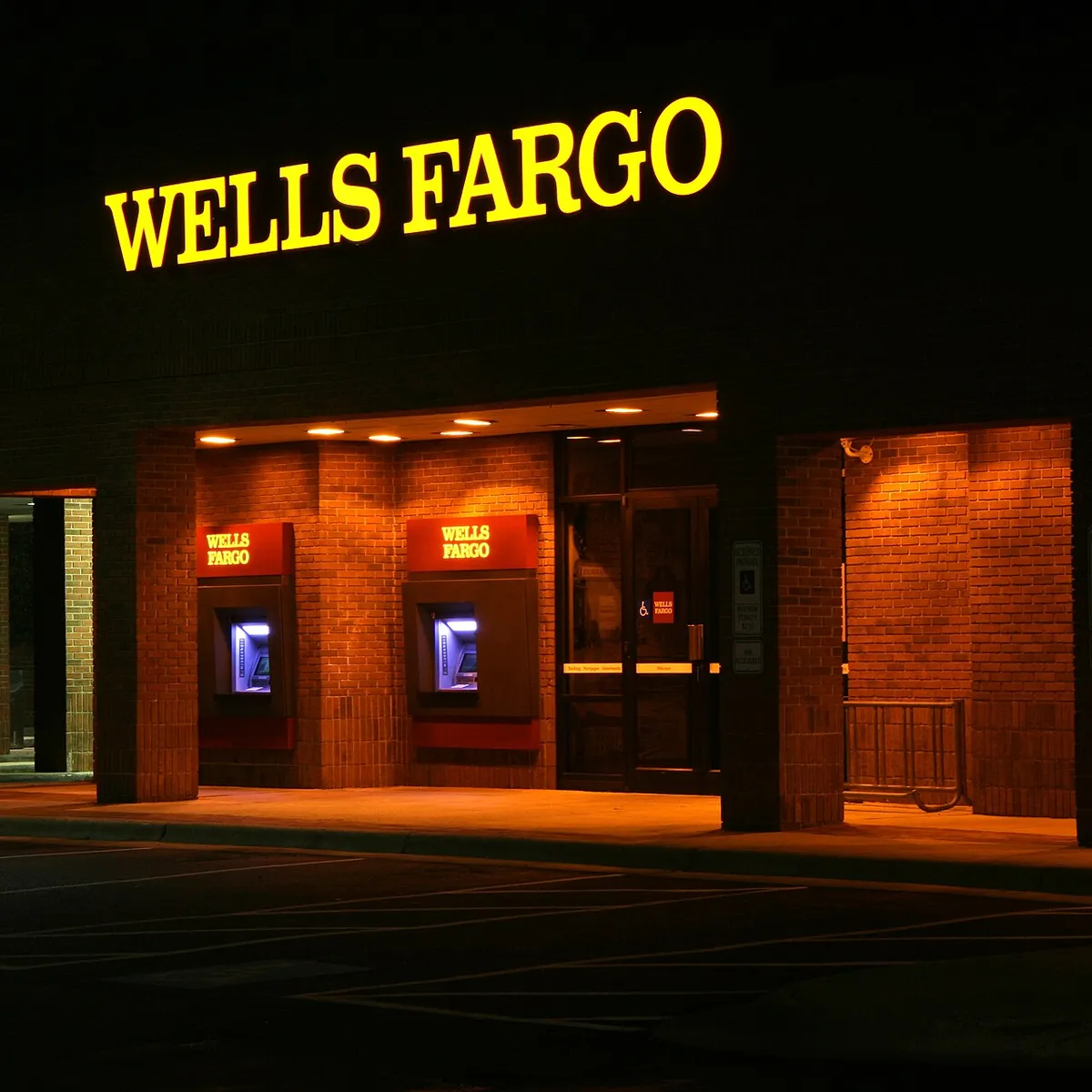 Wells Fargo walk up ATMs lit at night on Ninth Street in Durham, North Carolina .