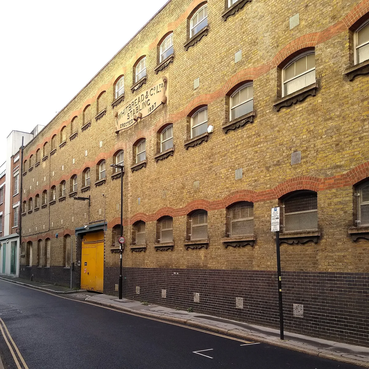 Whitbread's Stables ("Whitbread & Co. Ltd. Stabling Erected 1897"), a historic building in London. .mw-parser-output .messagebox{margin:4px 0;width:auto;border-collapse:collapse;border:2px solid var(-